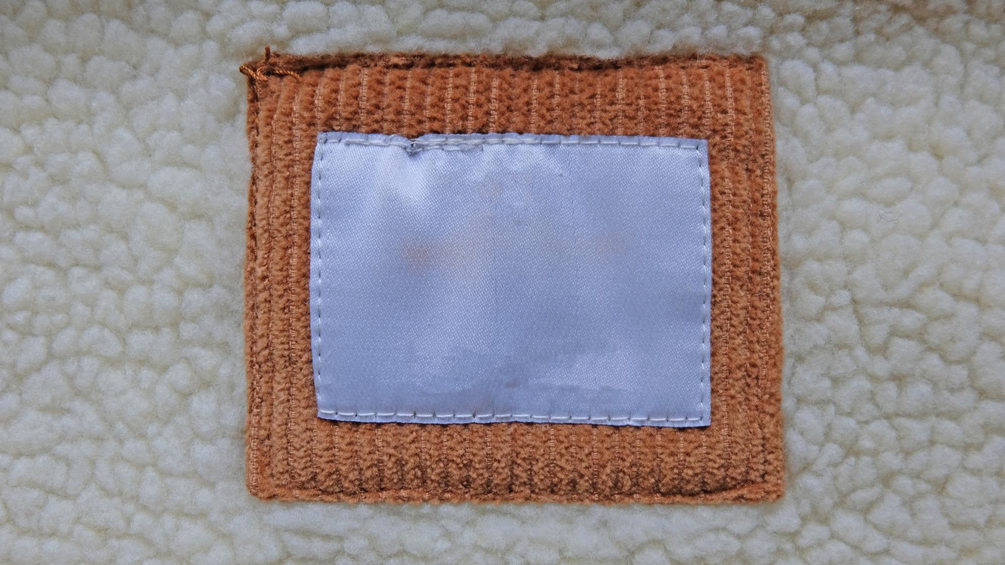 stack of embroidered patches and labels